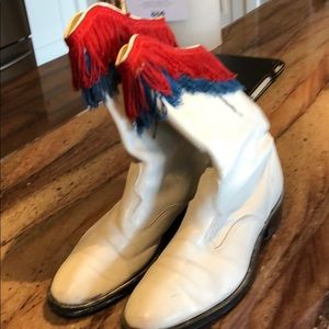 White cowboy boots with red and blue fringe